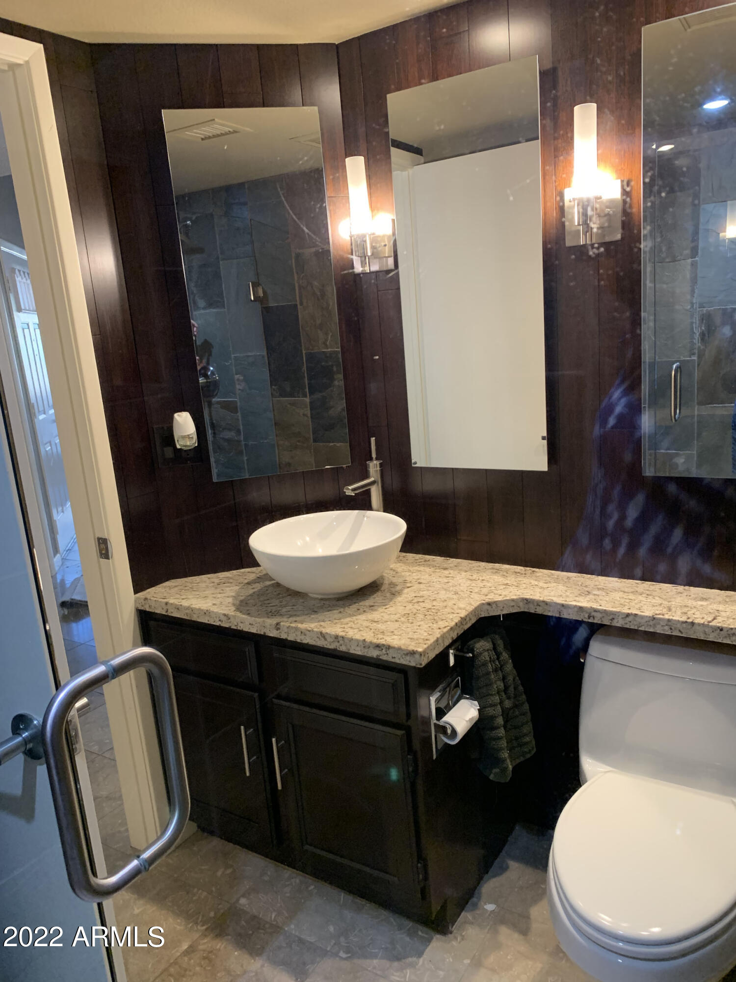 4302 East Bannock Street Phoenix, AZ 85044 - Photo 21 of 55 a bathroom with a sink a toilet a mirror and shower