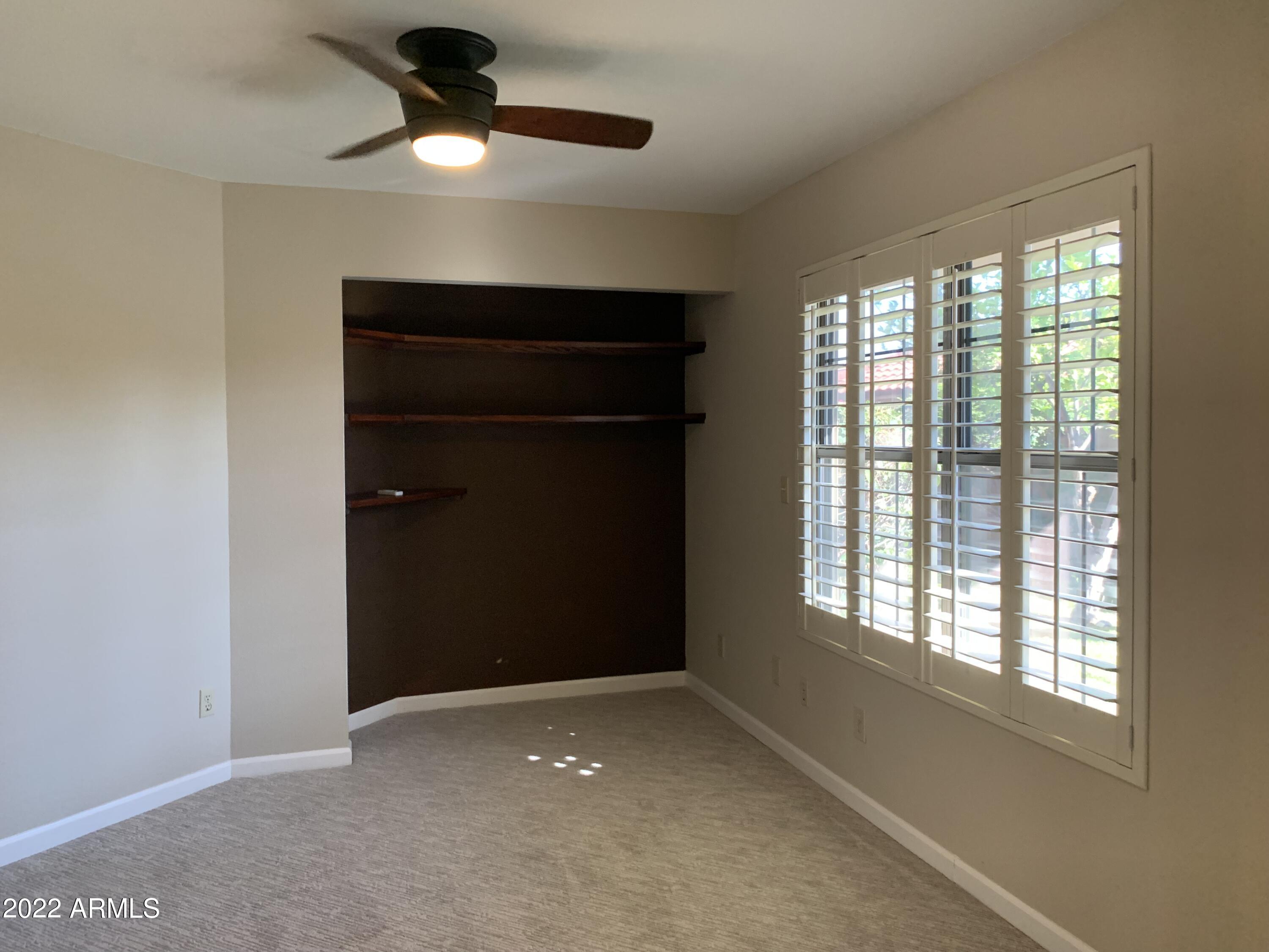 4302 East Bannock Street Phoenix, AZ 85044 - Photo 30 of 55 a view of an empty room with a window