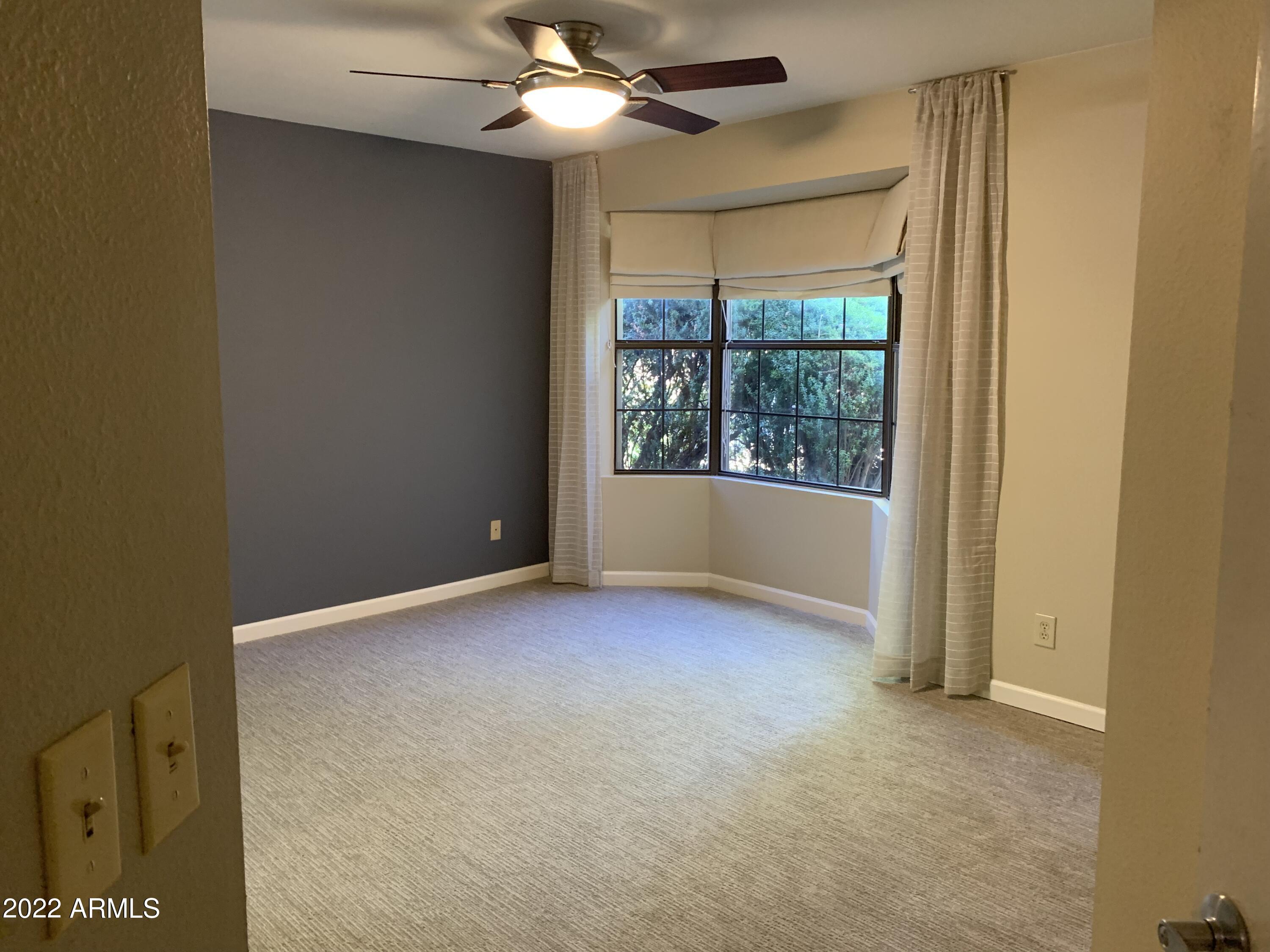 4302 East Bannock Street Phoenix, AZ 85044 - Photo 34 of 55 a view of an empty room with a window