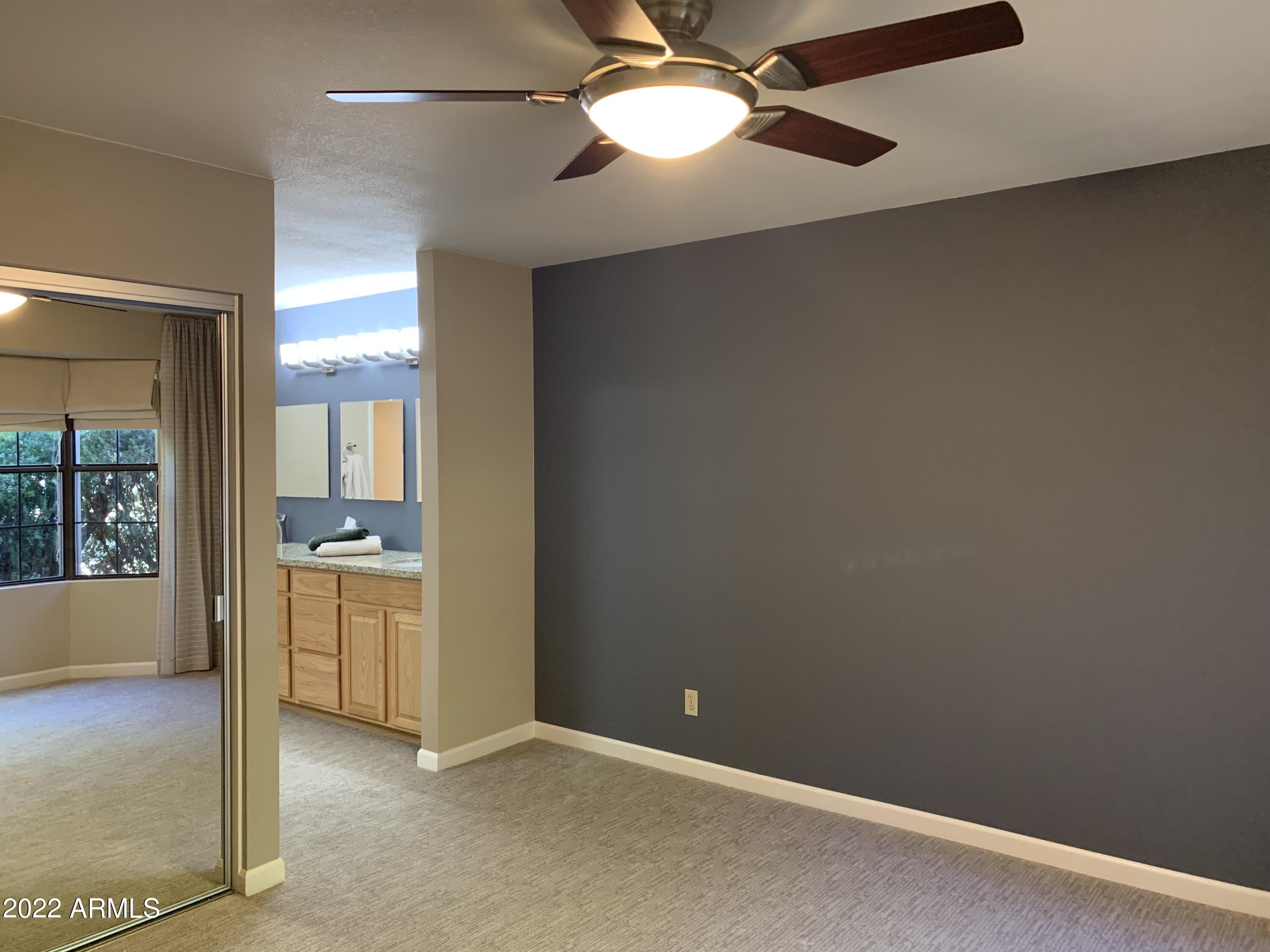 4302 East Bannock Street Phoenix, AZ 85044 - Photo 35 of 55 a view of an empty room with a window