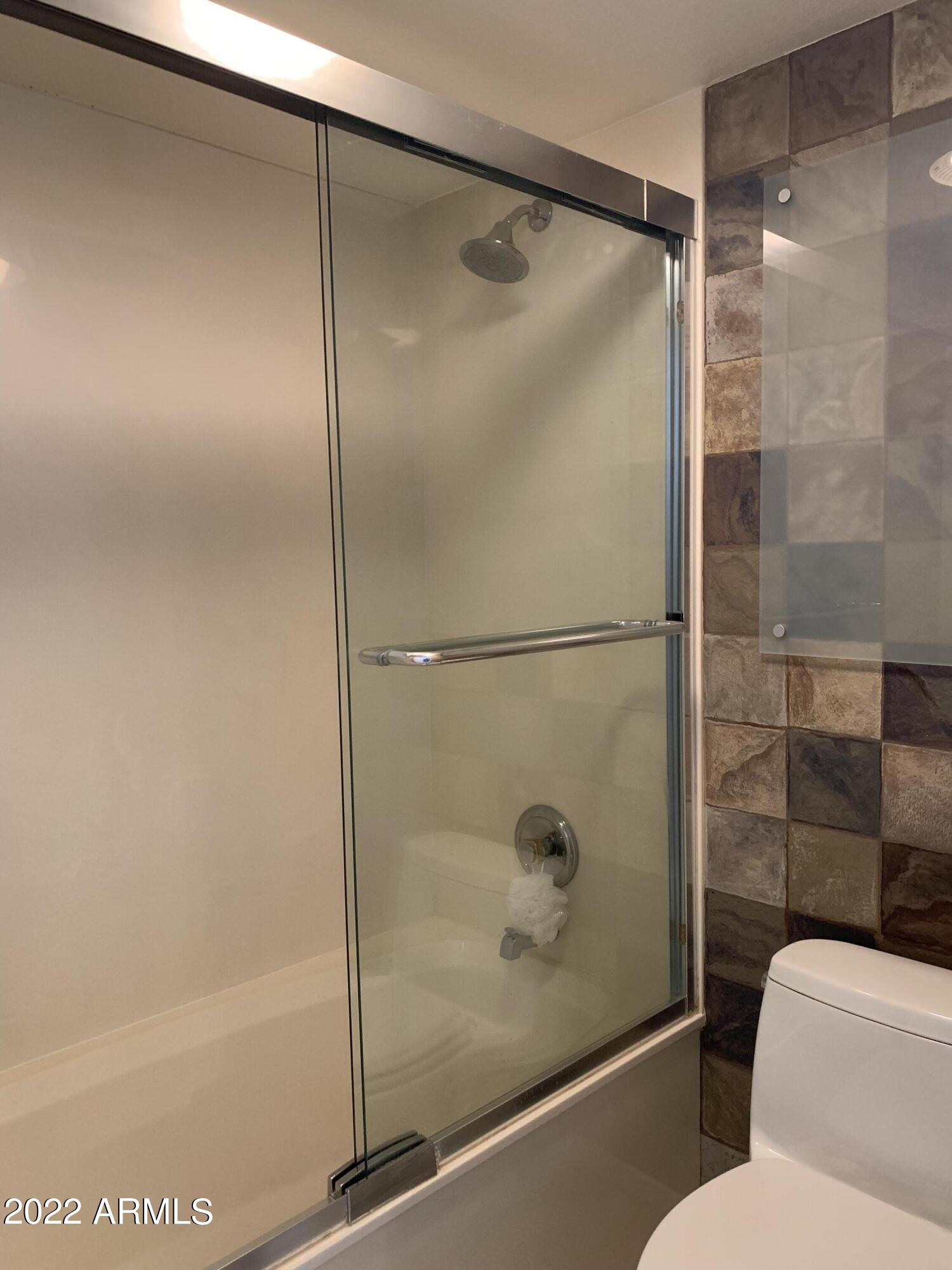 4302 East Bannock Street Phoenix, AZ 85044 - Photo 39 of 55 a bathroom with a glass shower door