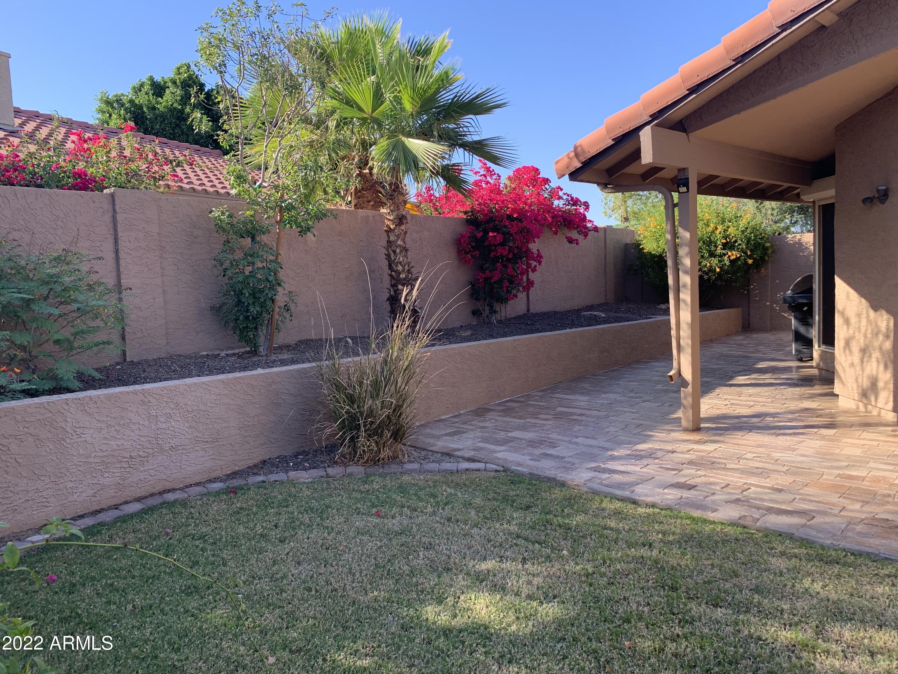 4302 East Bannock Street Phoenix, AZ 85044 - Photo 5 of 55 a front view of a house with a yard