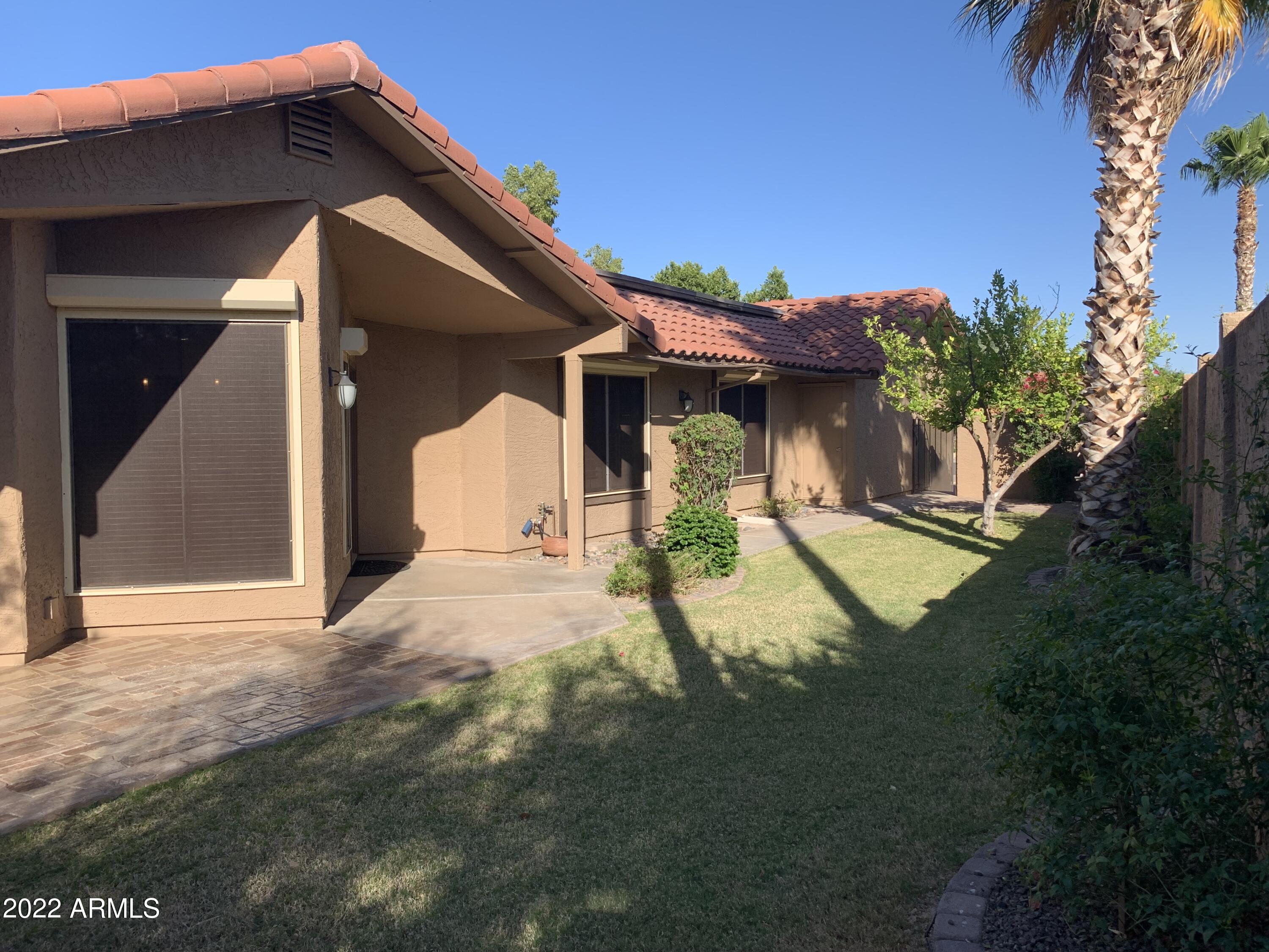 4302 East Bannock Street Phoenix, AZ 85044 - Photo 7 of 55 a view of a house with a yard