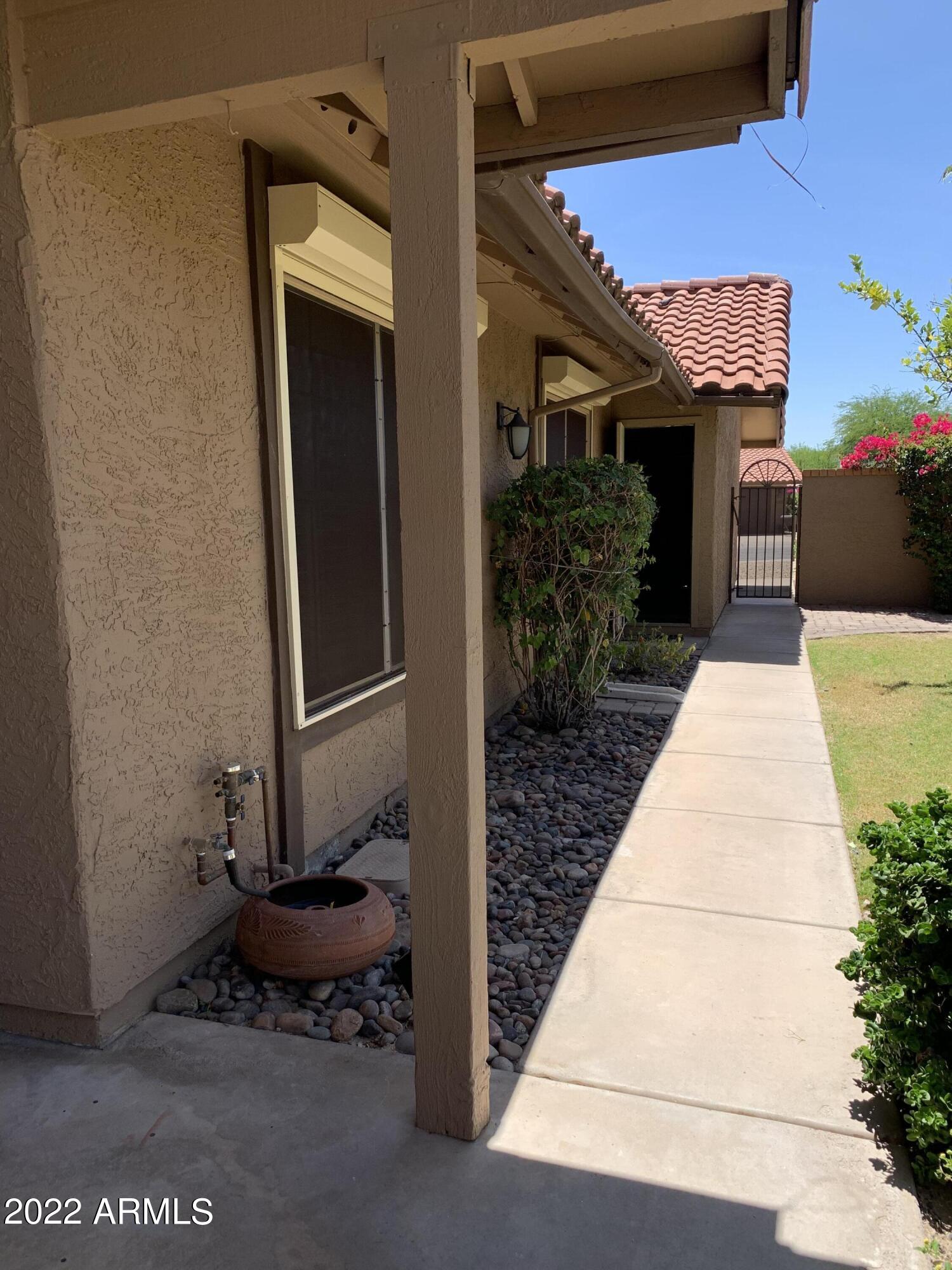 4302 East Bannock Street Phoenix, AZ 85044 - Photo 10 of 55 a view of a door and chair in front of house