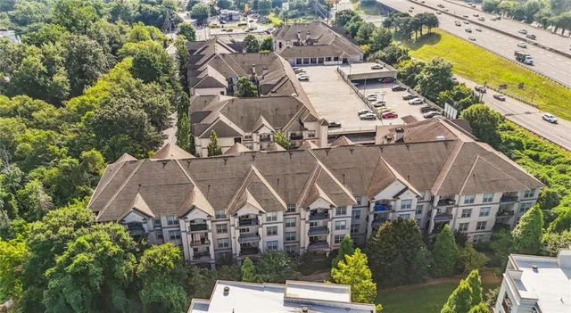 an aerial view of a house with a swimming pool