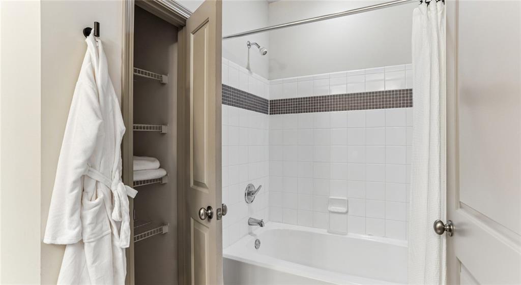 2910 Clairmont Road, Unit PLAN 6 Atlanta, GA 30329 - Photo 28 of 29 a bathroom with a bathtub and a shower