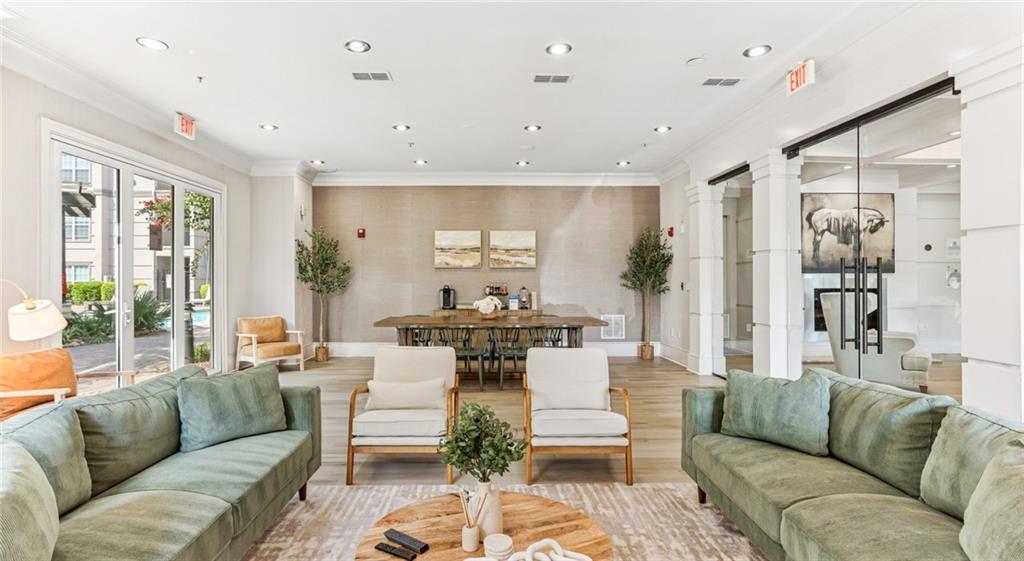 2910 Clairmont Road, Unit PLAN 6 Atlanta, GA 30329 - Photo 7 of 29 a living room with furniture wooden floor and a large window