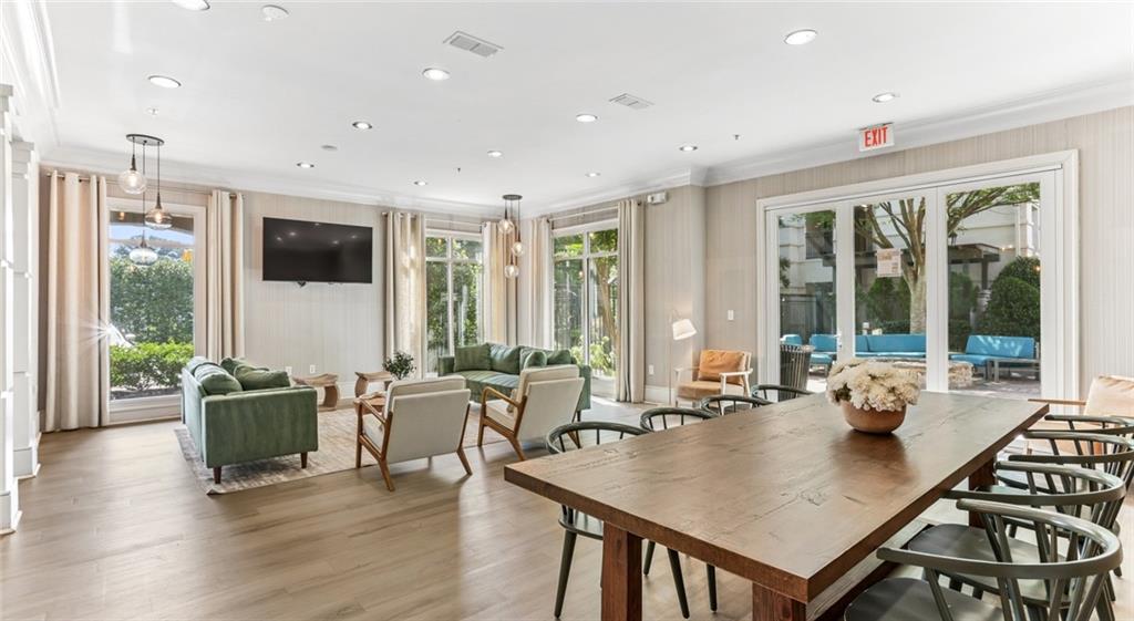 2910 Clairmont Road, Unit PLAN 6 Atlanta, GA 30329 - Photo 9 of 29 a living room with furniture two large window and wooden floor