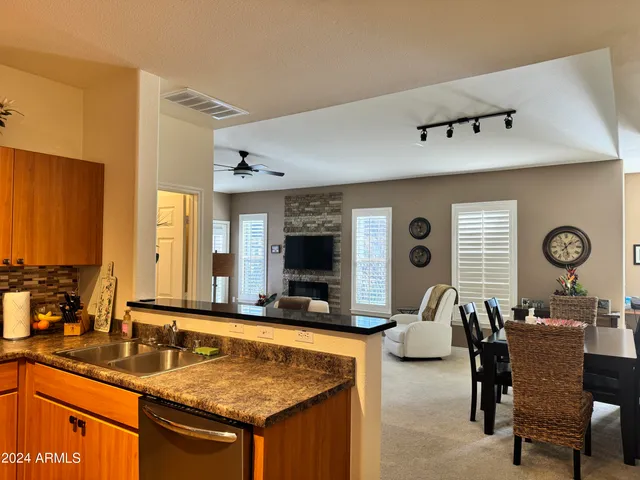 a view of living room filled with furniture and window