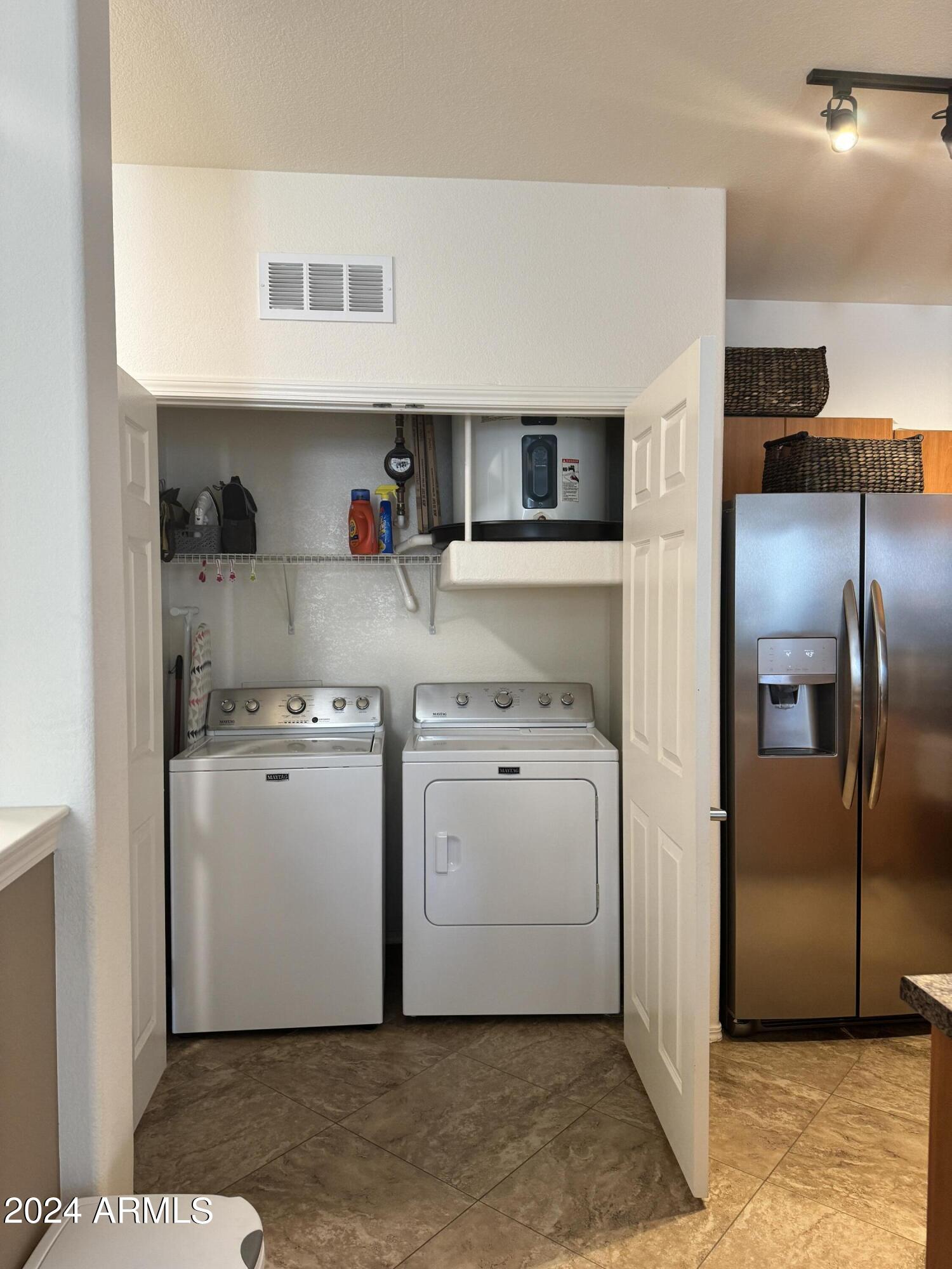14250 West Wigwam Boulevard, Unit 1421 Litchfield Park, AZ 85340 - Photo 8 of 15 a utility room with dryer and washer