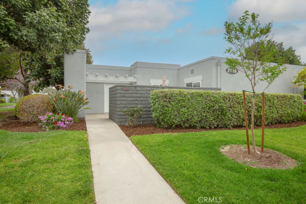 Welcome to 2116-A Via Puerta, a charming upgraded two-bedroom single-level NEW VALENCIA in the Laguna Woods senior community. This residence is a condo - not a coop. Note the beautiful curb appeal. Landscaping is managed by the Mutual.