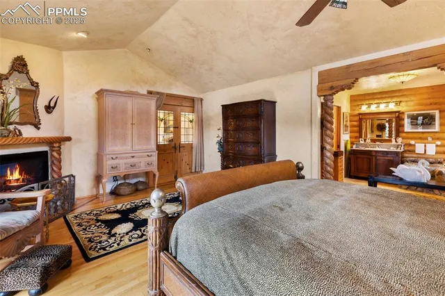 a living room with furniture a chandelier and a dining table