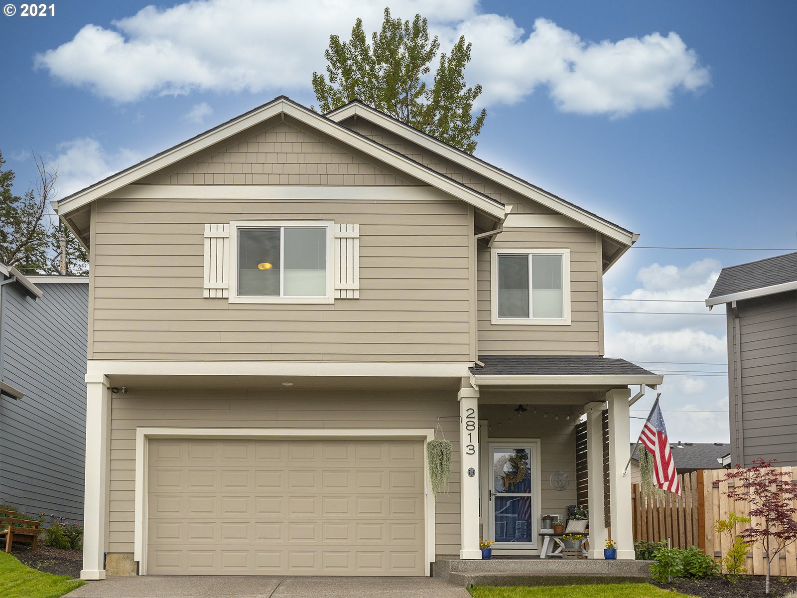 2813 Southeast Baker Avenue Gresham, OR 97080 - Photo 2 of 32 a front view of a house with a yard