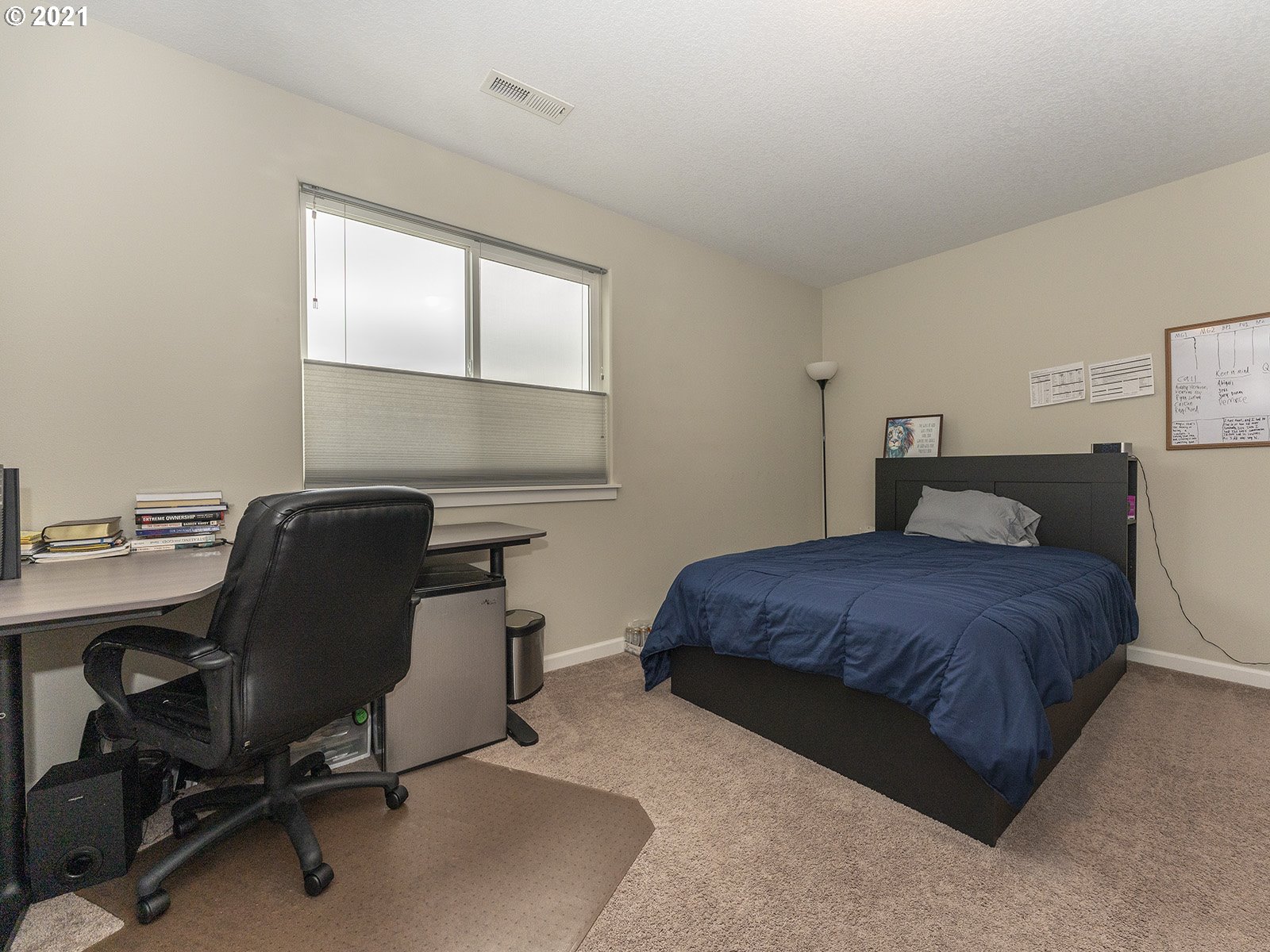 2813 Southeast Baker Avenue Gresham, OR 97080 - Photo 21 of 32 a bedroom with a large bed and a desk