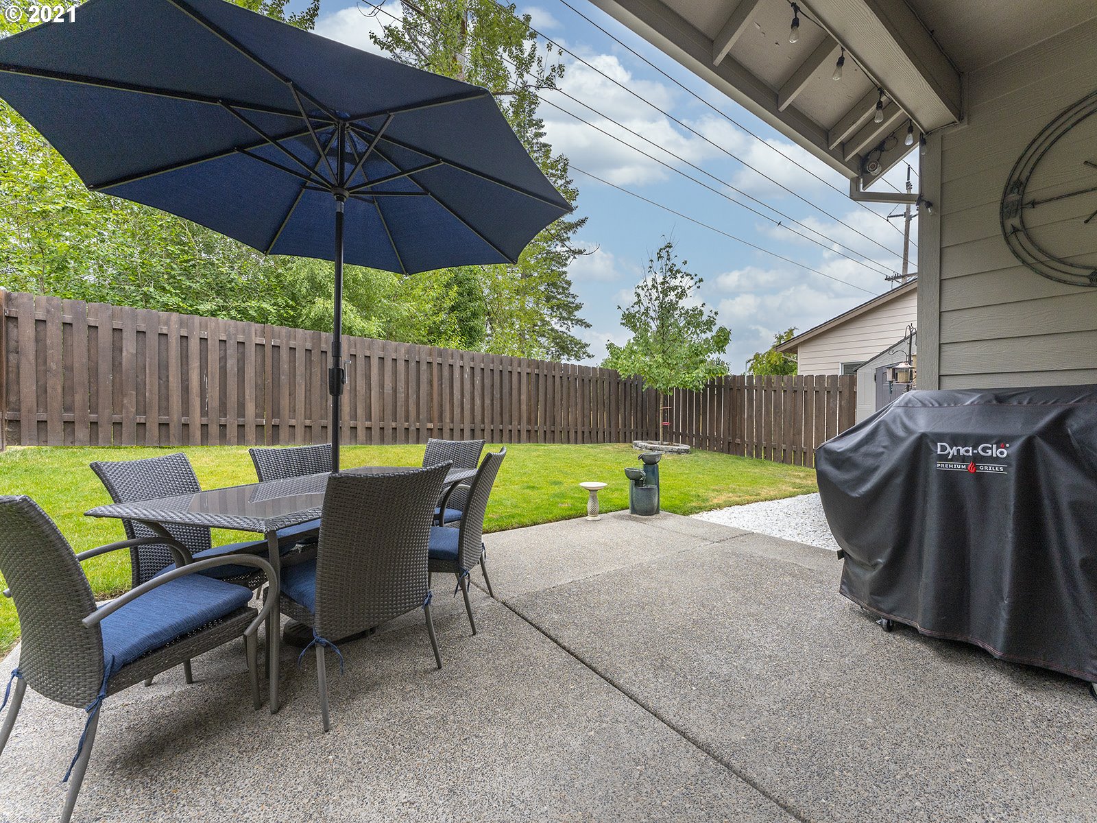 2813 Southeast Baker Avenue Gresham, OR 97080 - Photo 27 of 32 a view of a chair and table in the back yard of the house