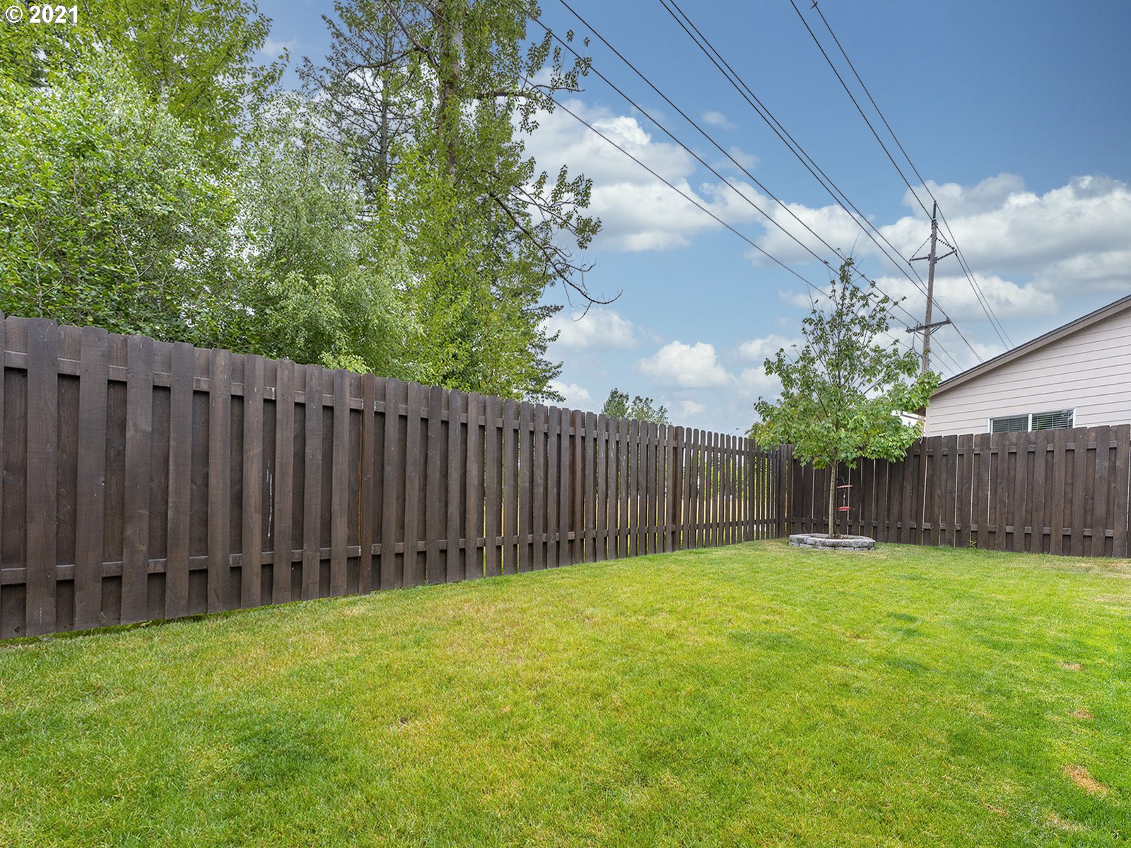 2813 Southeast Baker Avenue Gresham, OR 97080 - Photo 28 of 32 a view of a backyard with potted plants and wooden fence
