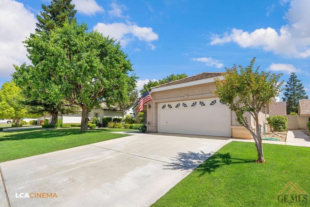 Undisclosed Address Bakersfield, CA 93311 - Photo 4 of 25 a view of a sign in front of a house with a big yard