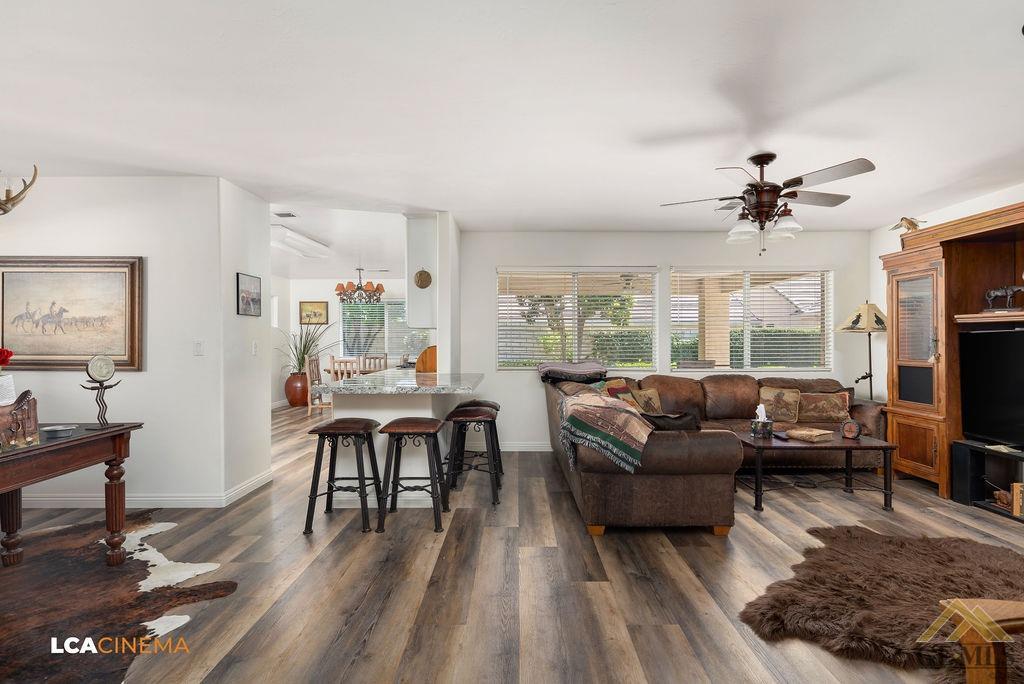 Undisclosed Address Bakersfield, CA 93311 - Photo 5 of 25 a living room with furniture a fireplace and a flat screen tv