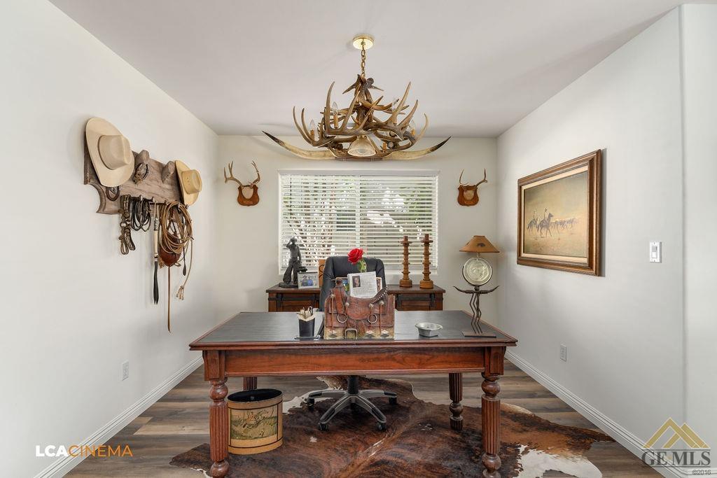 Undisclosed Address Bakersfield, CA 93311 - Photo 6 of 25 a view of a dining room with furniture window and wooden floor