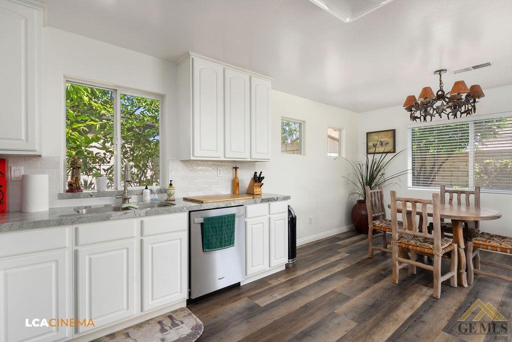 Undisclosed Address Bakersfield, CA 93311 - Photo 10 of 25 a kitchen with white cabinets and sink