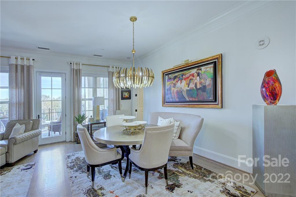 2823 Providence Road, Unit 254 Charlotte, NC 28211 - Photo 12 of 44 a view of a dining room with furniture window and wooden floor
