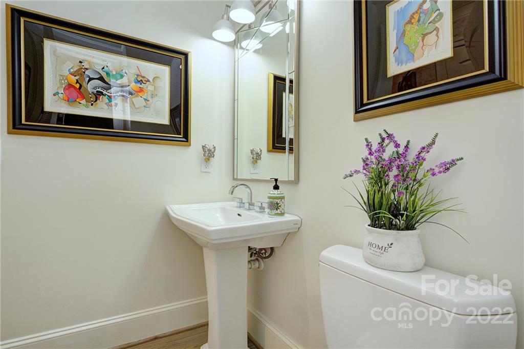2823 Providence Road, Unit 254 Charlotte, NC 28211 - Photo 14 of 44 a bathroom with a sink a mirror and vanity