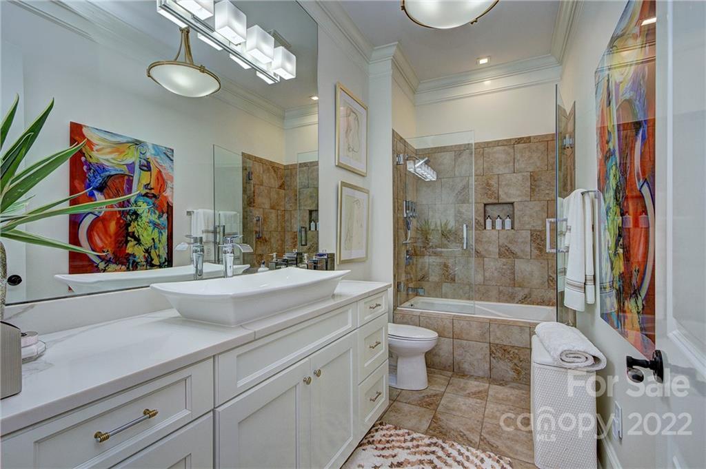2823 Providence Road, Unit 254 Charlotte, NC 28211 - Photo 23 of 44 a bathroom with a sink a toilet and shower