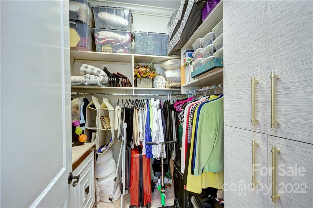 2823 Providence Road, Unit 254 Charlotte, NC 28211 - Photo 24 of 44 a view of walk in closet with clothes and shoes