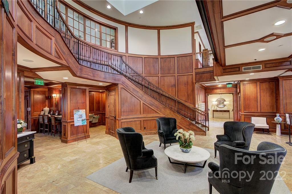 2823 Providence Road, Unit 254 Charlotte, NC 28211 - Photo 34 of 44 a living room with furniture a piano and a rug