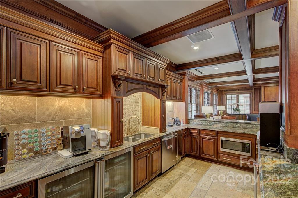 2823 Providence Road, Unit 254 Charlotte, NC 28211 - Photo 37 of 44 a kitchen with granite countertop a sink stainless steel appliances and cabinets