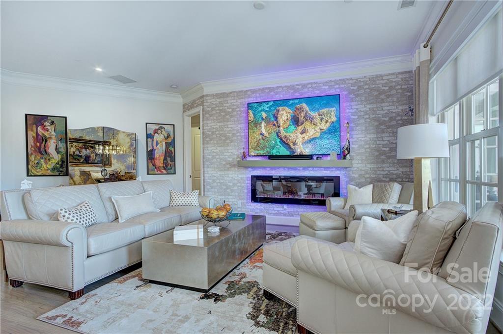 2823 Providence Road, Unit 254 Charlotte, NC 28211 - Photo 5 of 44 a living room with furniture and a fireplace