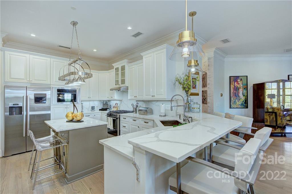 2823 Providence Road, Unit 254 Charlotte, NC 28211 - Photo 7 of 44 a kitchen with a table and chairs in it