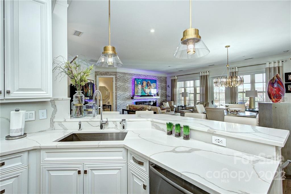 2823 Providence Road, Unit 254 Charlotte, NC 28211 - Photo 9 of 44 a kitchen with a sink a stove and cabinets