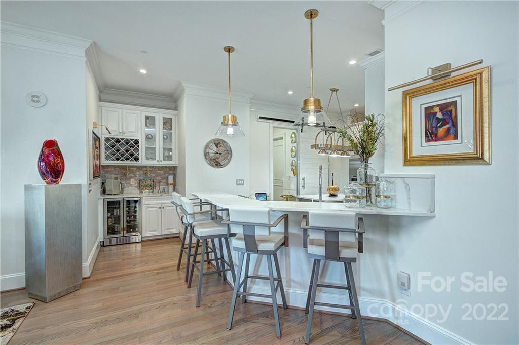 2823 Providence Road, Unit 254 Charlotte, NC 28211 - Photo 10 of 44 a view of a dining room with furniture and wooden floor
