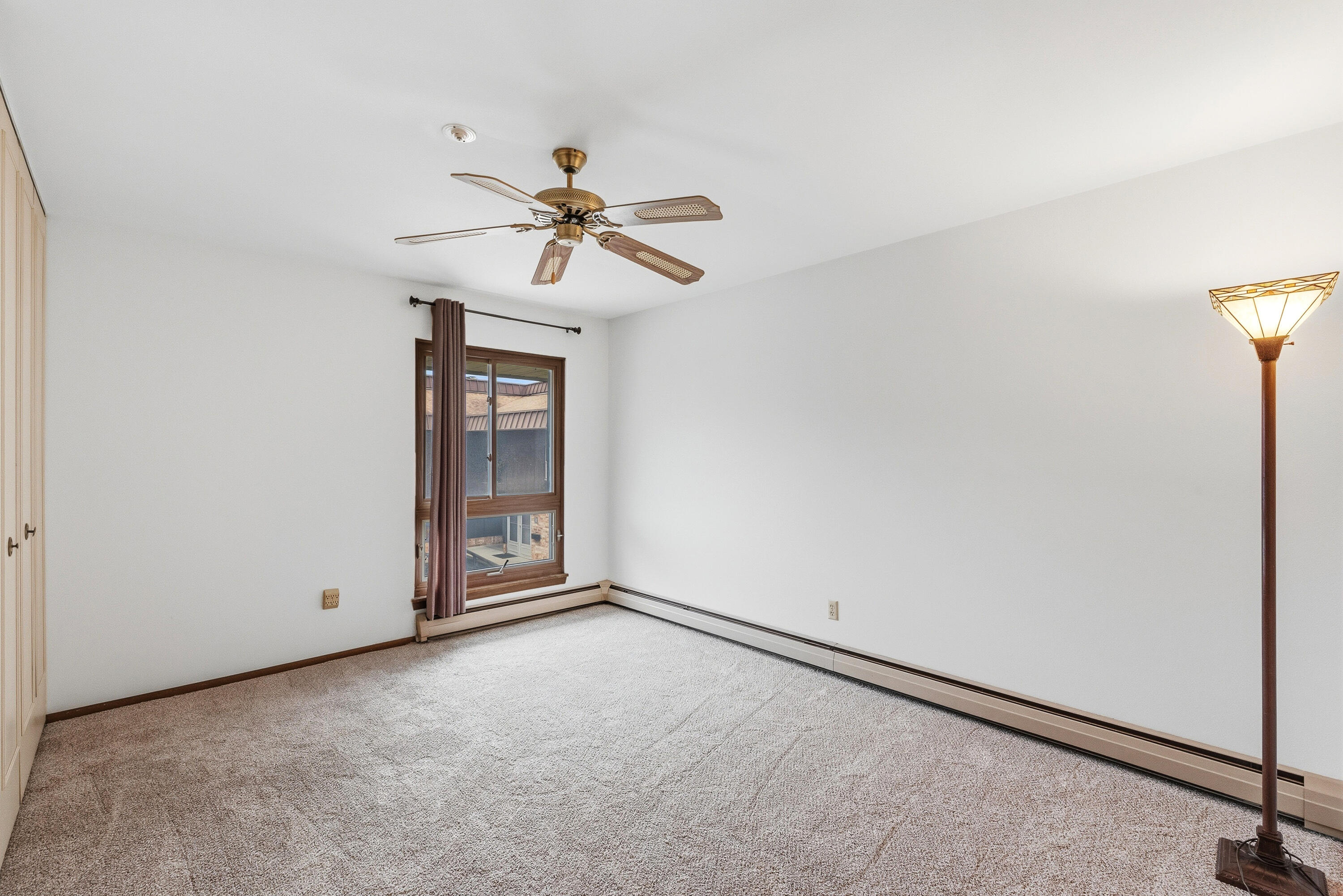 4155 West Rivers Edge Circle, Unit 4 Brown Deer, WI 53209 - Photo 5 of 18 Bedroom 1 with large walk-in closet
