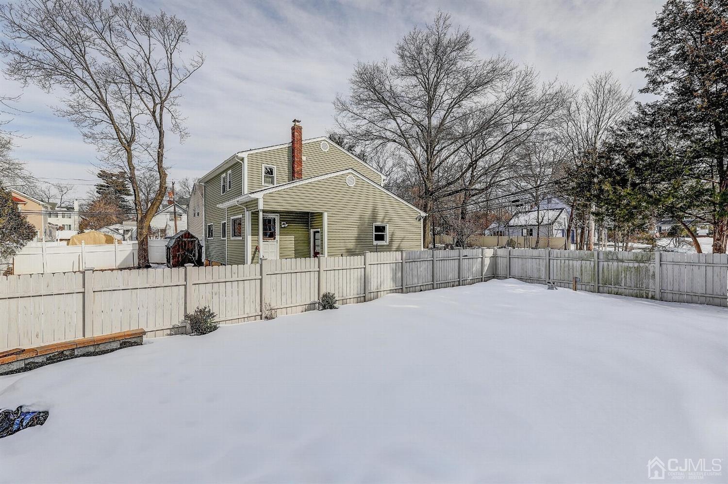 1 Paddock Court Edison, NJ 08820 - Photo 14 of 18 a view of white house with a snow in the yard