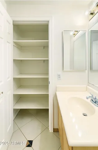 a bathroom with a tub sink and a mirror