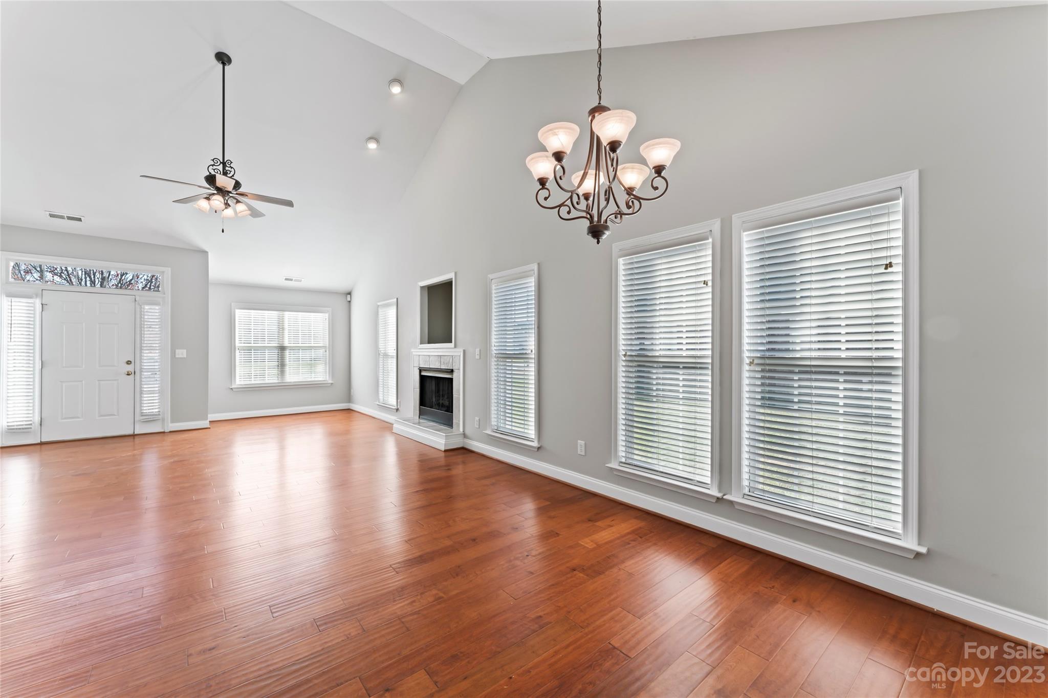 3205 McGee Lane Monroe, NC 28110 - Photo 11 of 34 a view of an empty room with wooden floor and a window