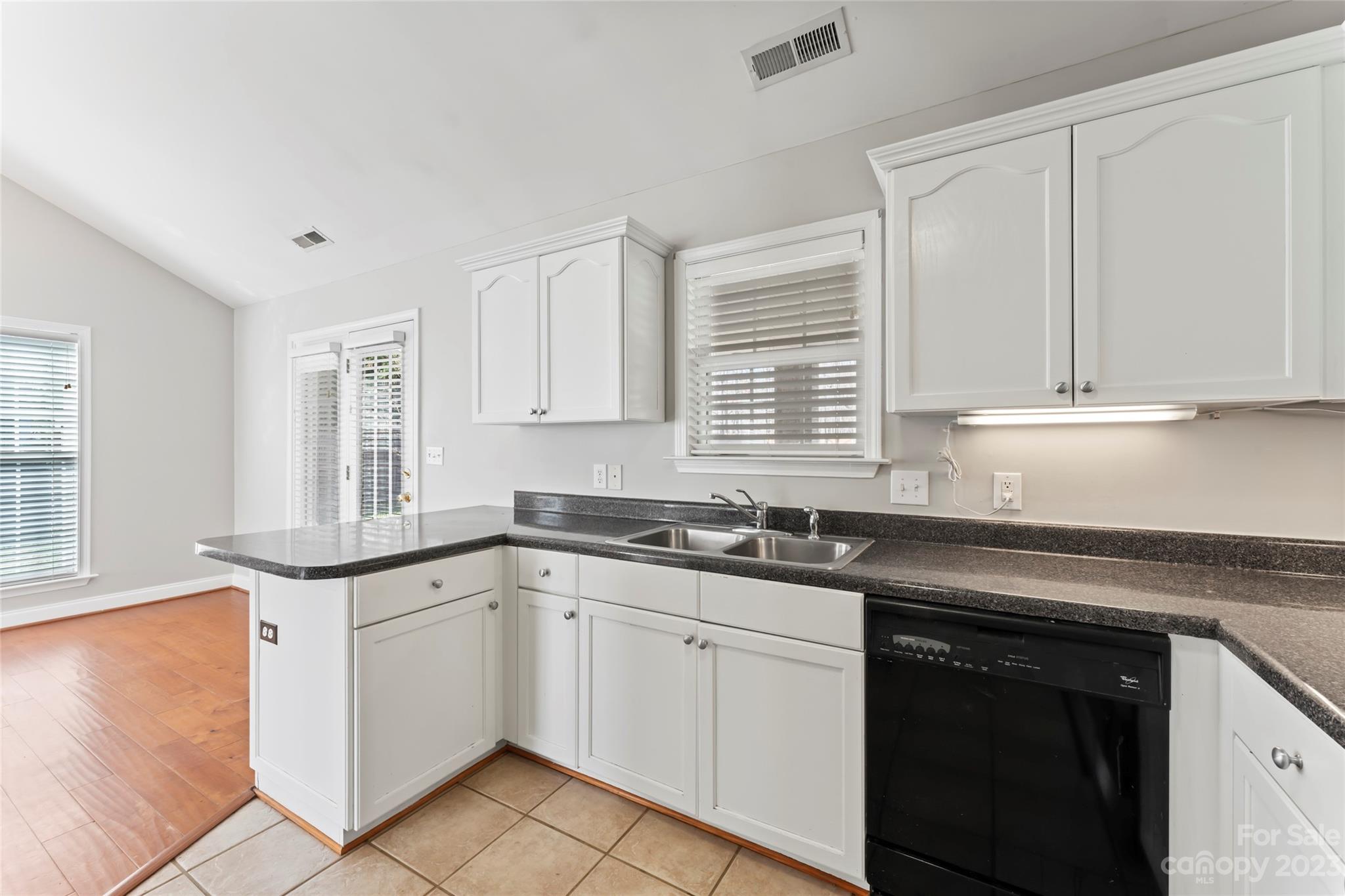 3205 McGee Lane Monroe, NC 28110 - Photo 14 of 34 a kitchen with granite countertop a sink and cabinets