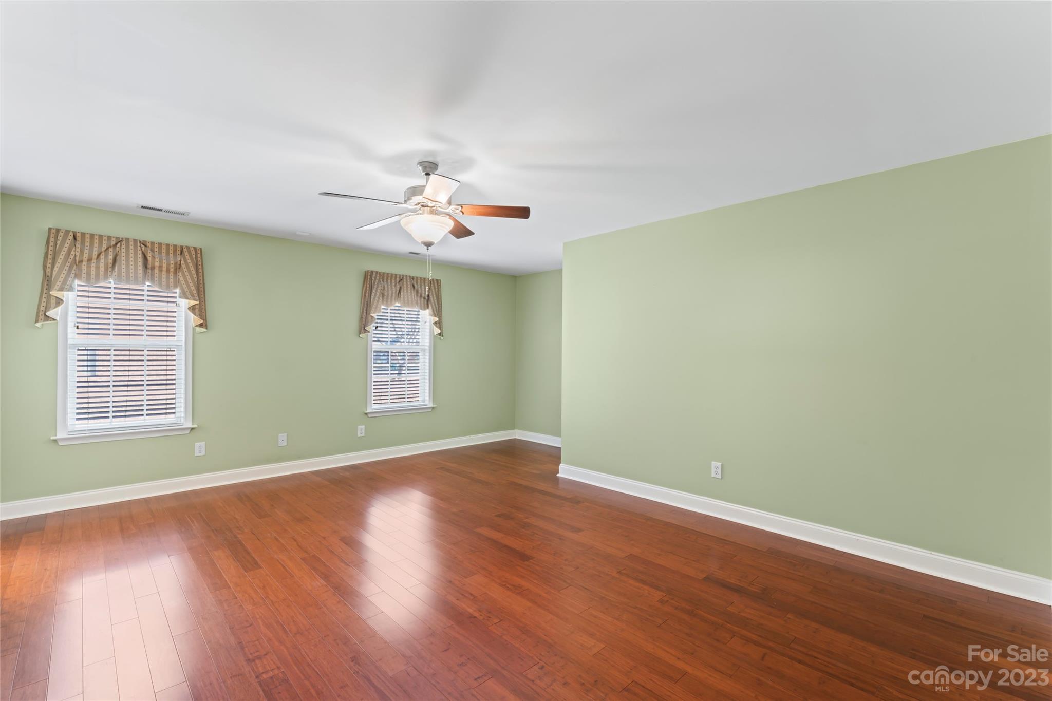 3205 McGee Lane Monroe, NC 28110 - Photo 17 of 34 a view of an empty room with wooden floor and a window