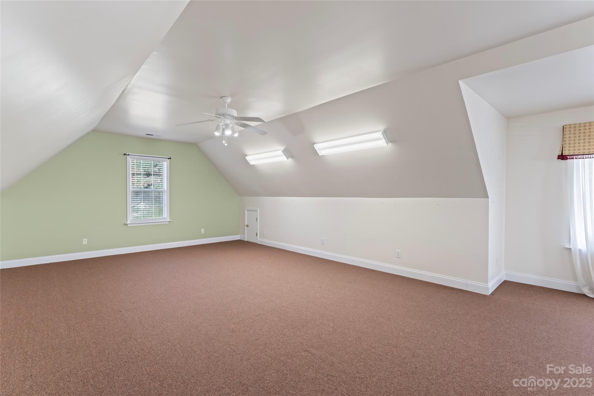 3205 McGee Lane Monroe, NC 28110 - Photo 25 of 34 an empty room with a empty space and windows