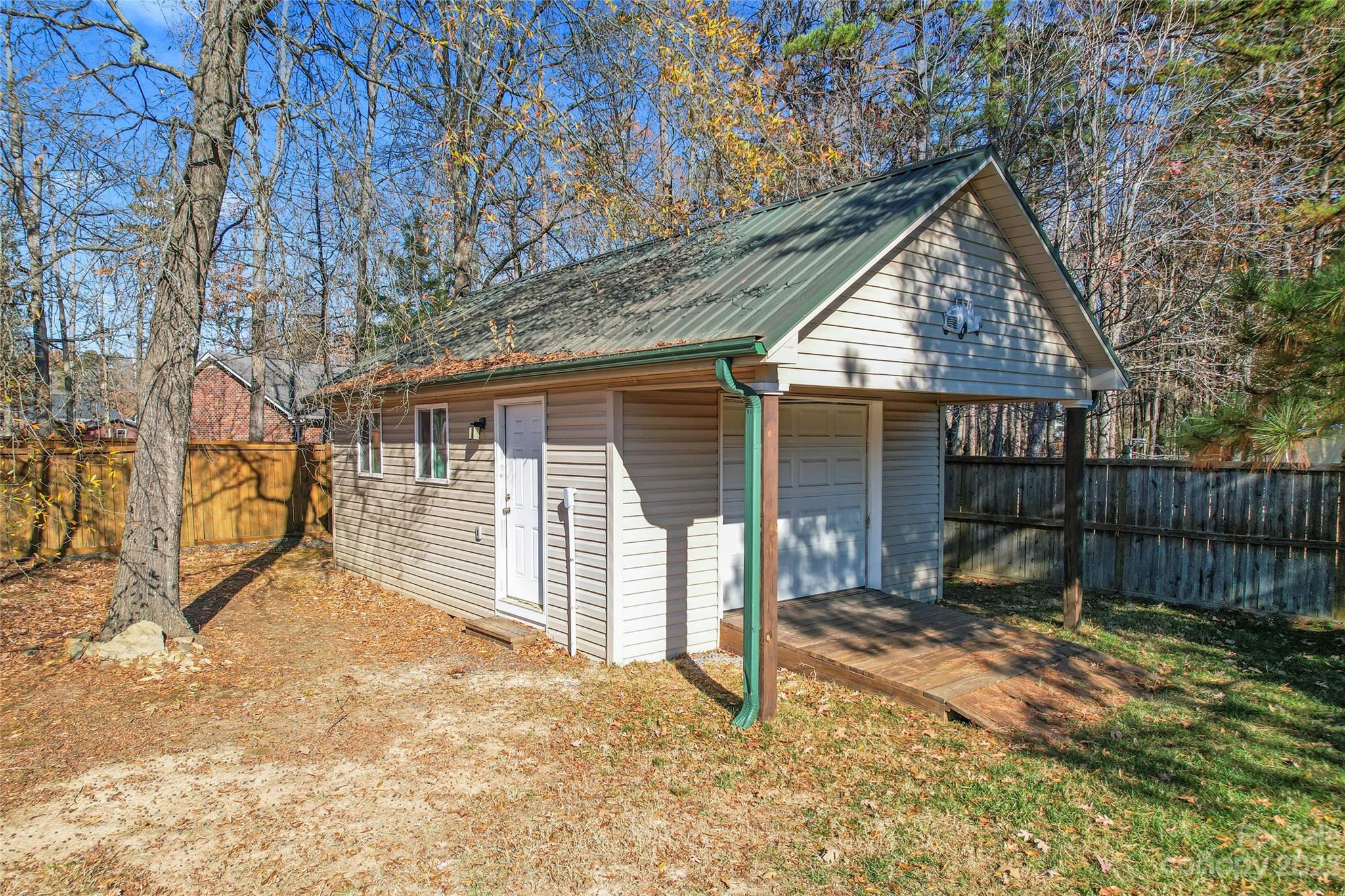 3205 McGee Lane Monroe, NC 28110 - Photo 31 of 34 a backyard of a house with garden