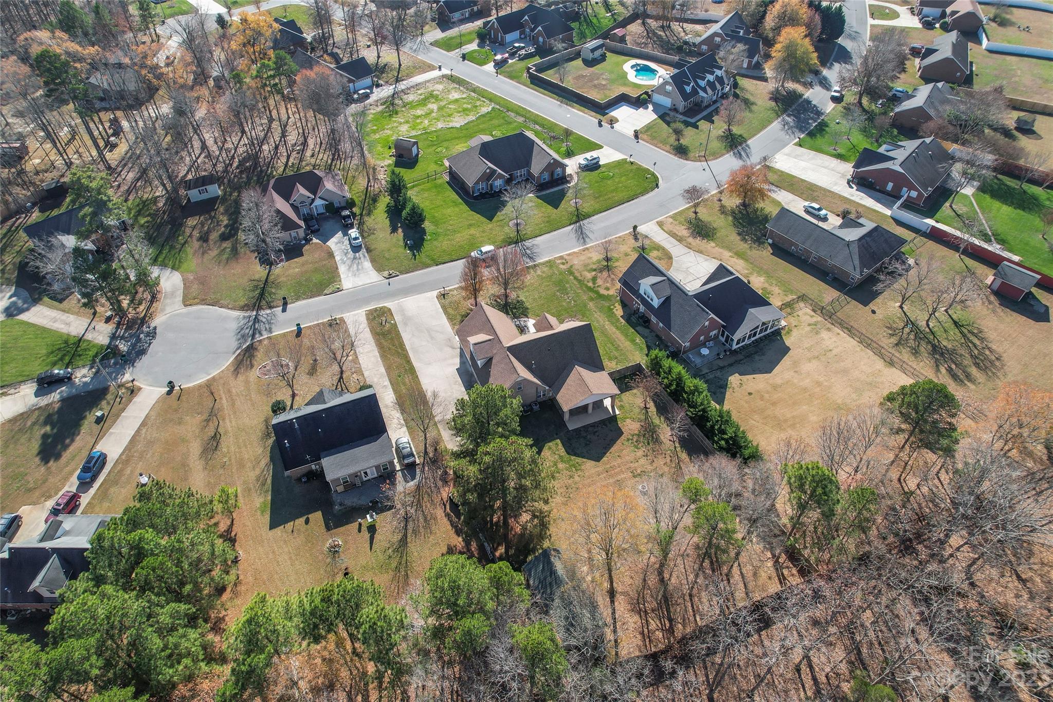 3205 McGee Lane Monroe, NC 28110 - Photo 8 of 34 an aerial view of residential house with outdoor space and swimming pool