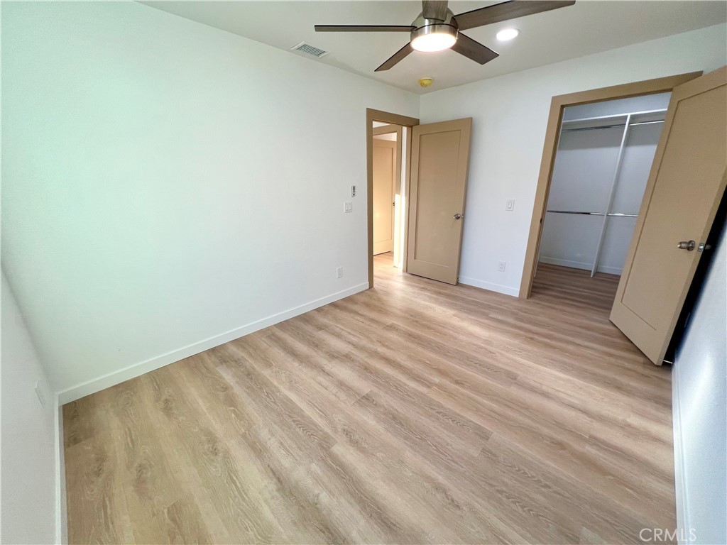 1133 Geraldine Avenue East, Unit B Lancaster, CA 93535 - Photo 13 of 27 wooden floor in an empty room