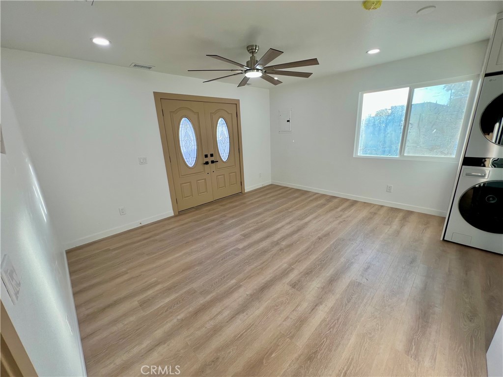 1133 Geraldine Avenue East, Unit B Lancaster, CA 93535 - Photo 2 of 27 a view of an empty room and wooden floor