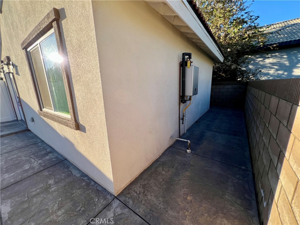 1133 Geraldine Avenue East, Unit B Lancaster, CA 93535 - Photo 21 of 27 a view of a hallway with wooden floor and stairs