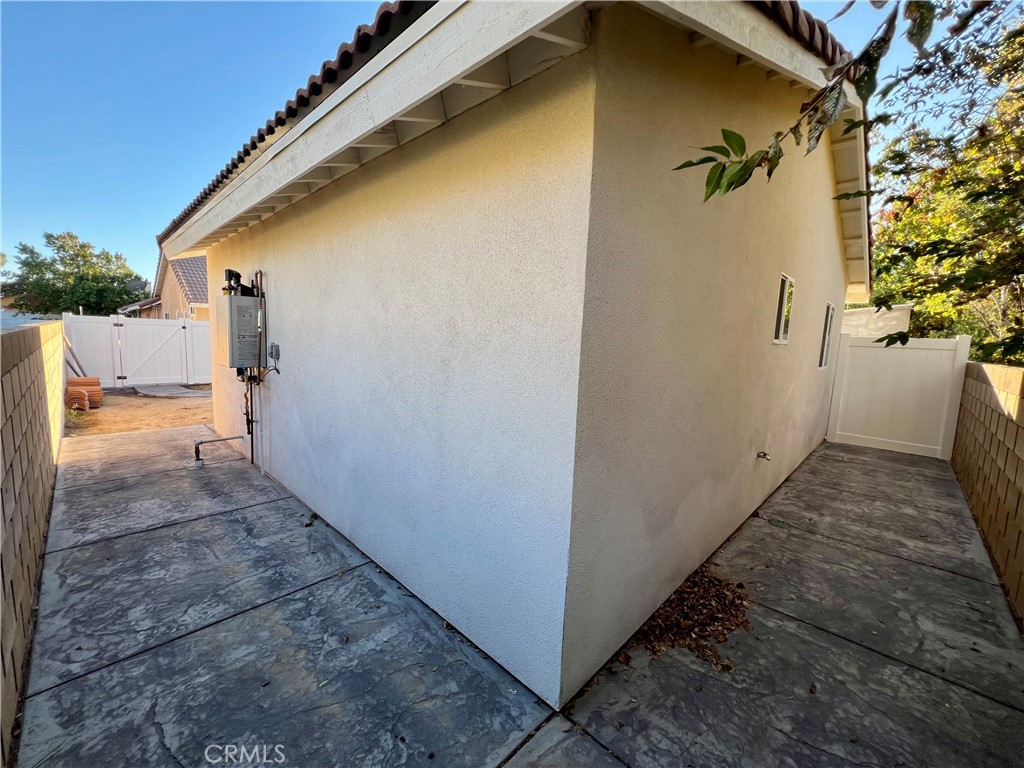 1133 Geraldine Avenue East, Unit B Lancaster, CA 93535 - Photo 22 of 27 a view of a house with a backyard