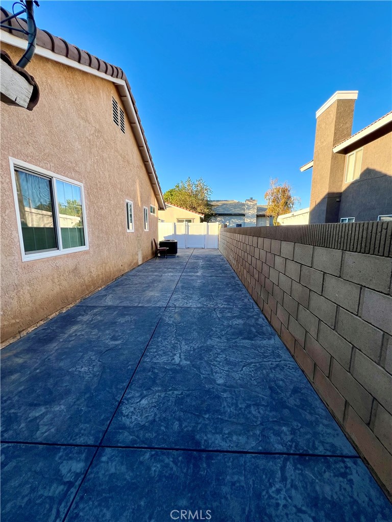 1133 Geraldine Avenue East, Unit B Lancaster, CA 93535 - Photo 27 of 27 a view of an outdoor space and a building