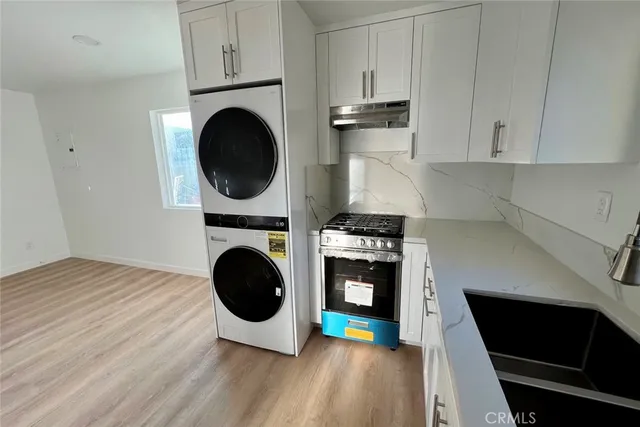 a view of a kitchen with washer and dryer