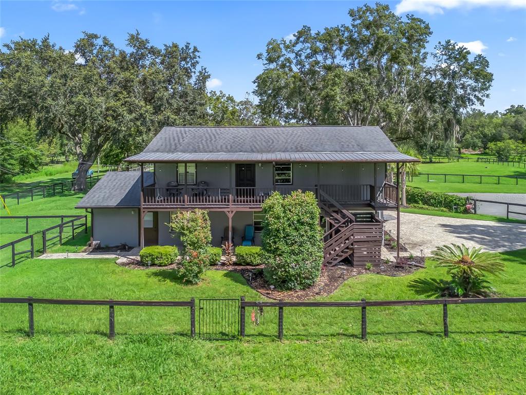 10291 Highway 40 Ocala, FL 34482 - Photo 14 of 21 a front view of a house with garden